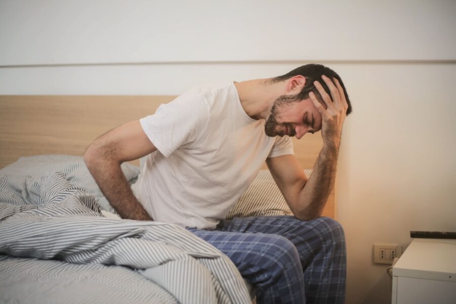 man suffering from colonic diverticulitis
