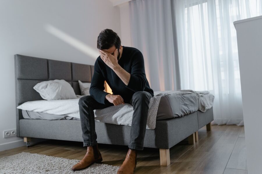 man suffering from fecal incontinence